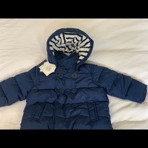 Toddler boys water resistant navy puffer jacket.